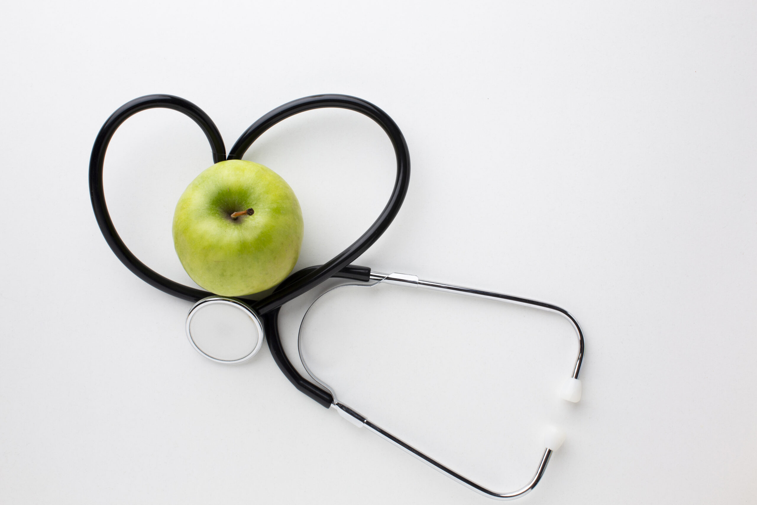 flat-lay-green-apple-stethoscope